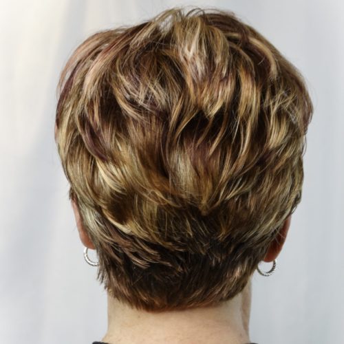 short layered haircut for women over 50 using  haircolor and highlights