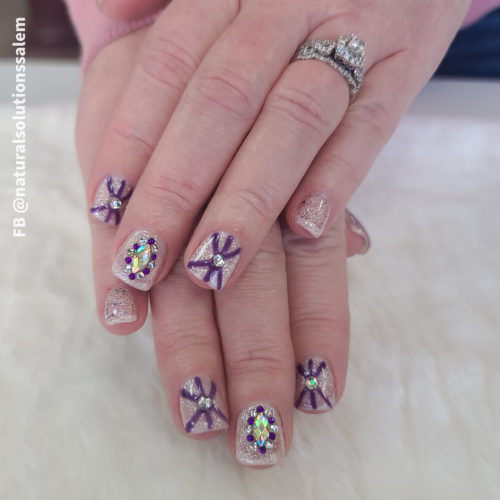 acrylic nails with pastel pink and purple gel polish by artist Stacey Kasler