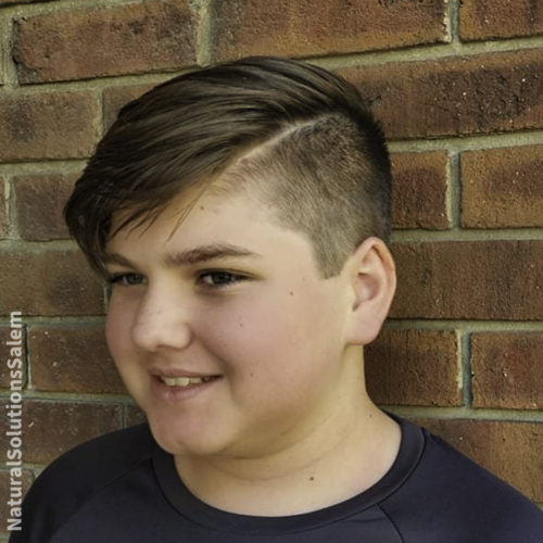 Get a popular boys haircut at Natural Solutions like a Comb Over + Hard Part Taper.