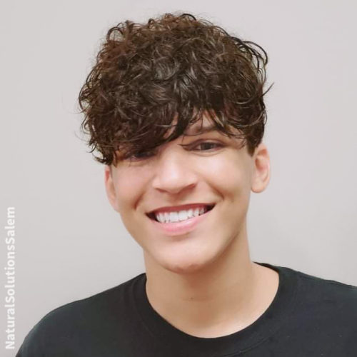a teenage boy haircut for curly hair that is long on top