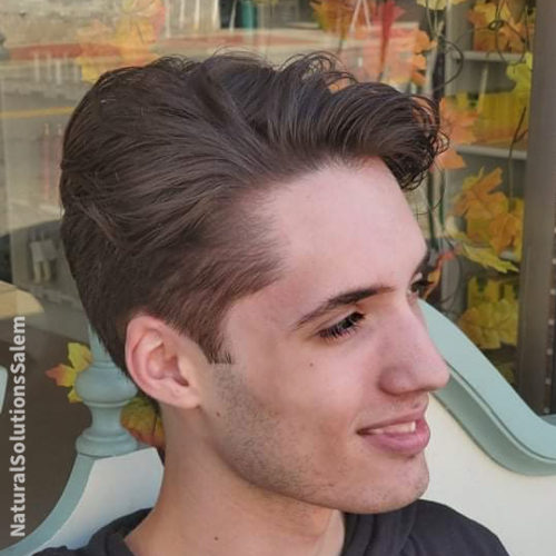 a teenage boy haircut that highlights clean lines and long on top