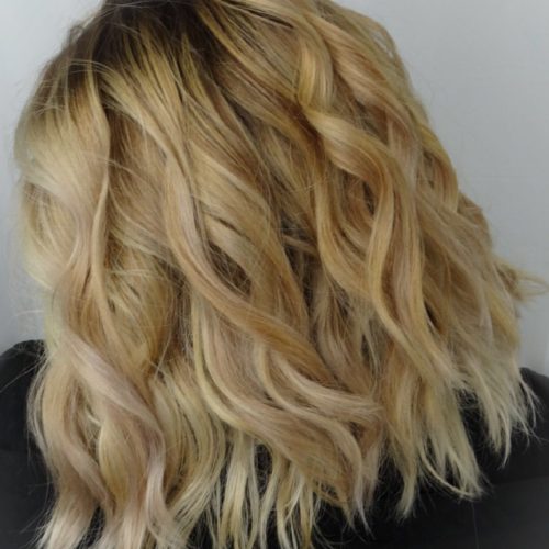 a medium length blonde highlight with shadow root