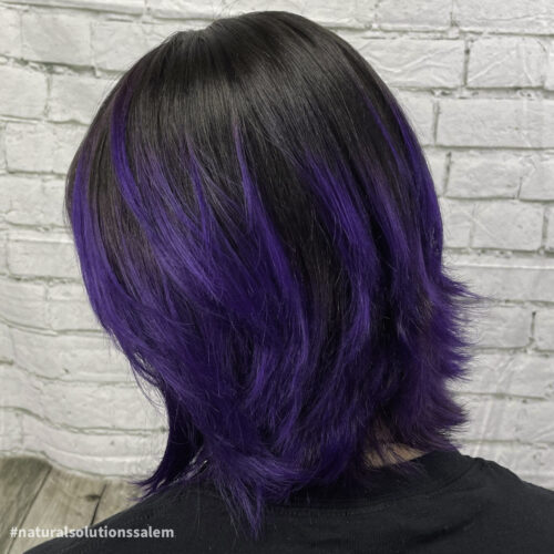 womens black hair can pop with purple highlights