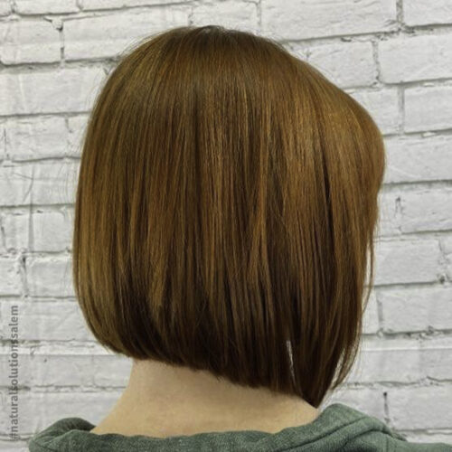 auburn hair color with a slanted bob haircut