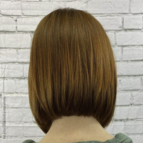auburn hair color with a slanted bob haircut