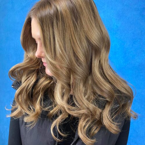 added dimension of highs and lows in this dark blondes long hair
